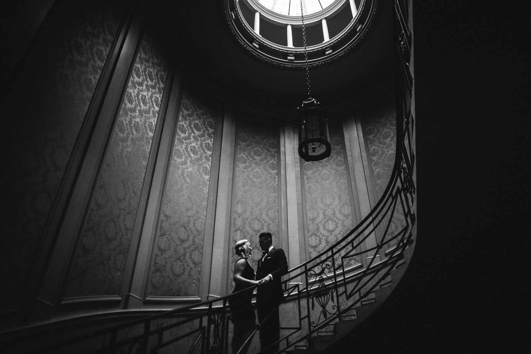 Engagement session with couple on round staircase at Parkwood Estate, Oshawa