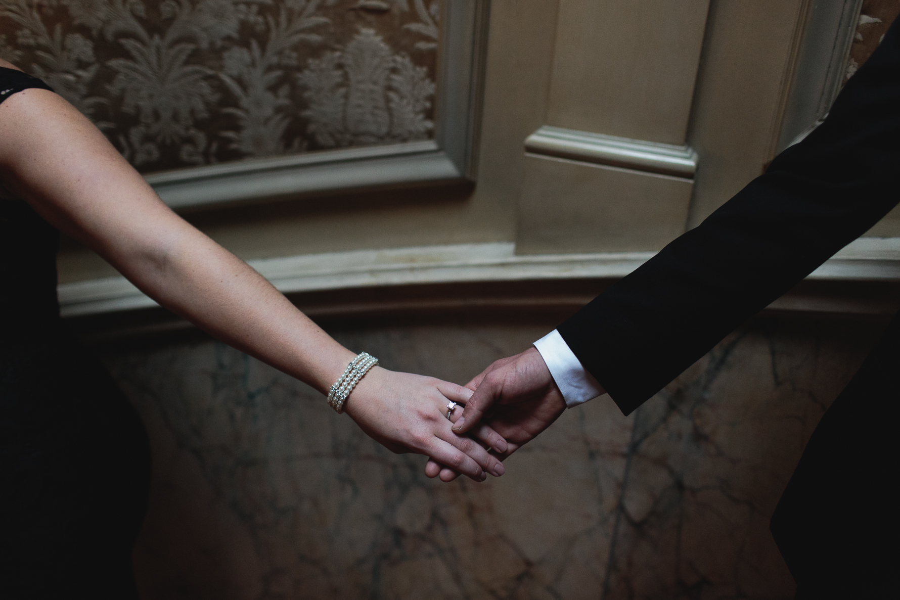 Couple holding hands at engagement session at Parkwood Estate, Oshawa