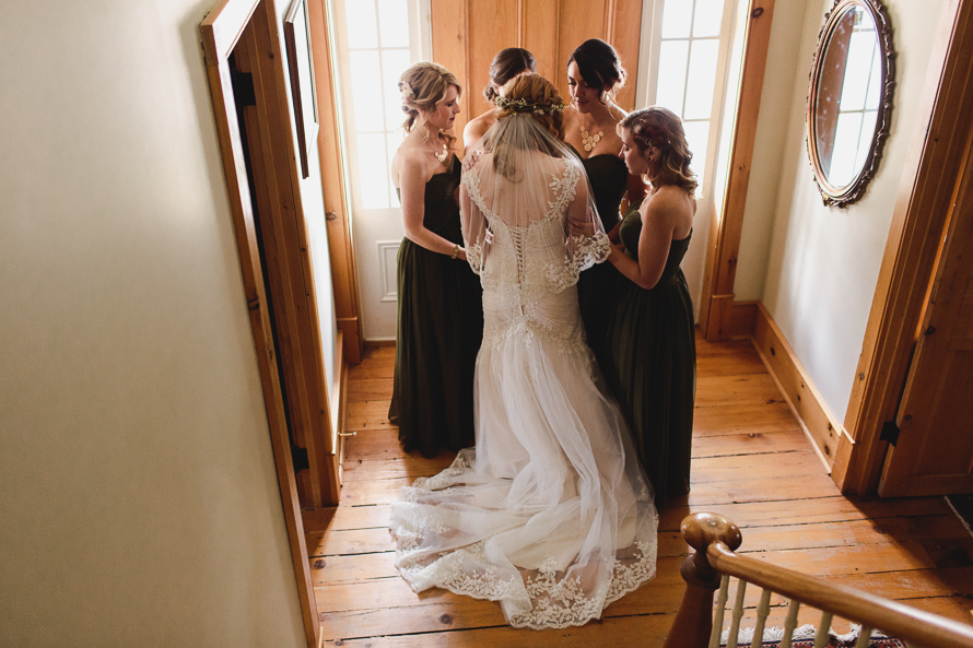 Intimate moment between the bride and her bridesmaids at Emilyville, Inn in Campbellford, Ontario