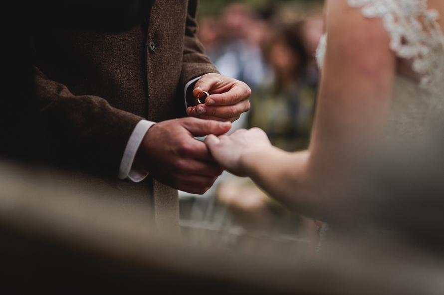 The ring exchange during wedding ceremony at Polmenna Barn in Campbellford, Ontario